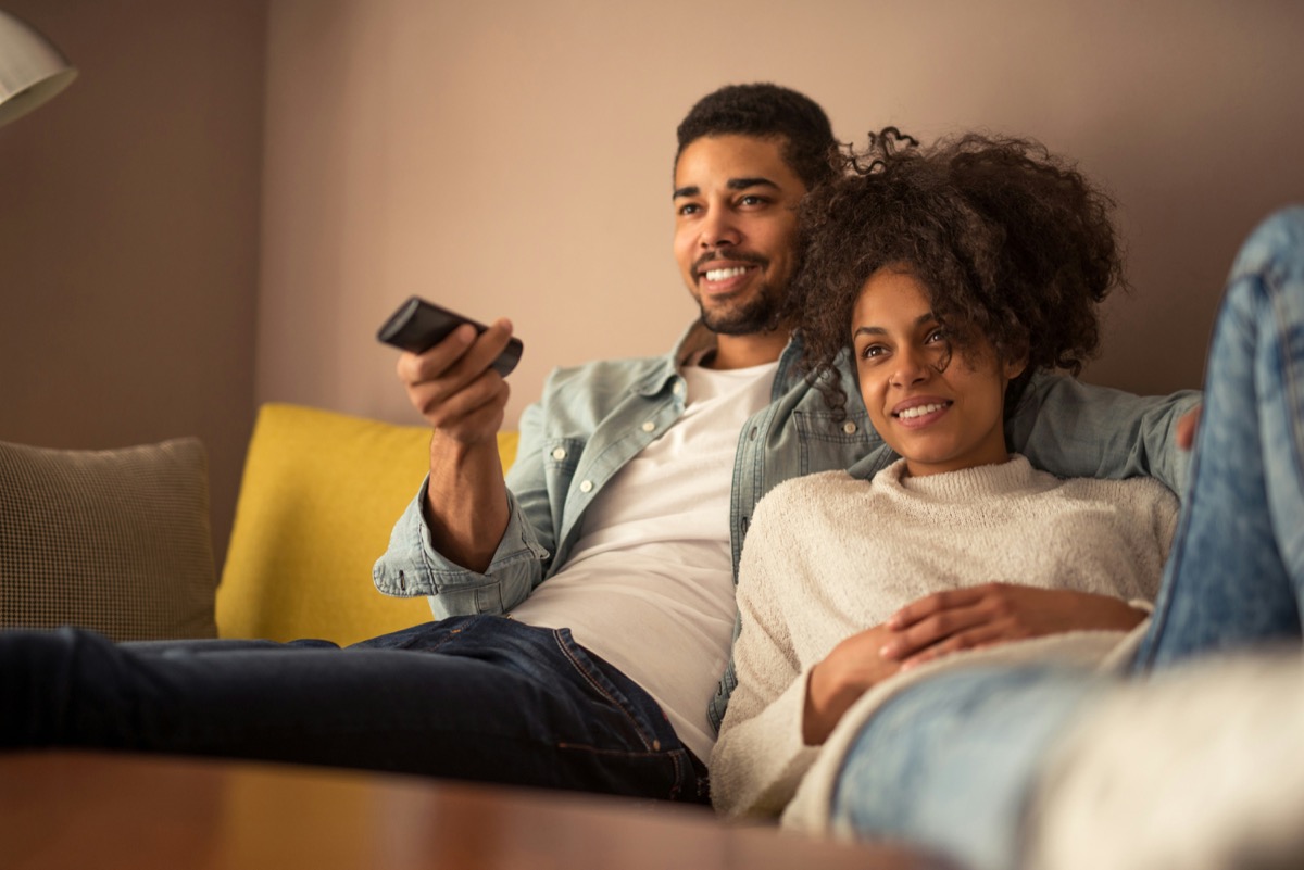 A couple settling in to watch on their own subscription